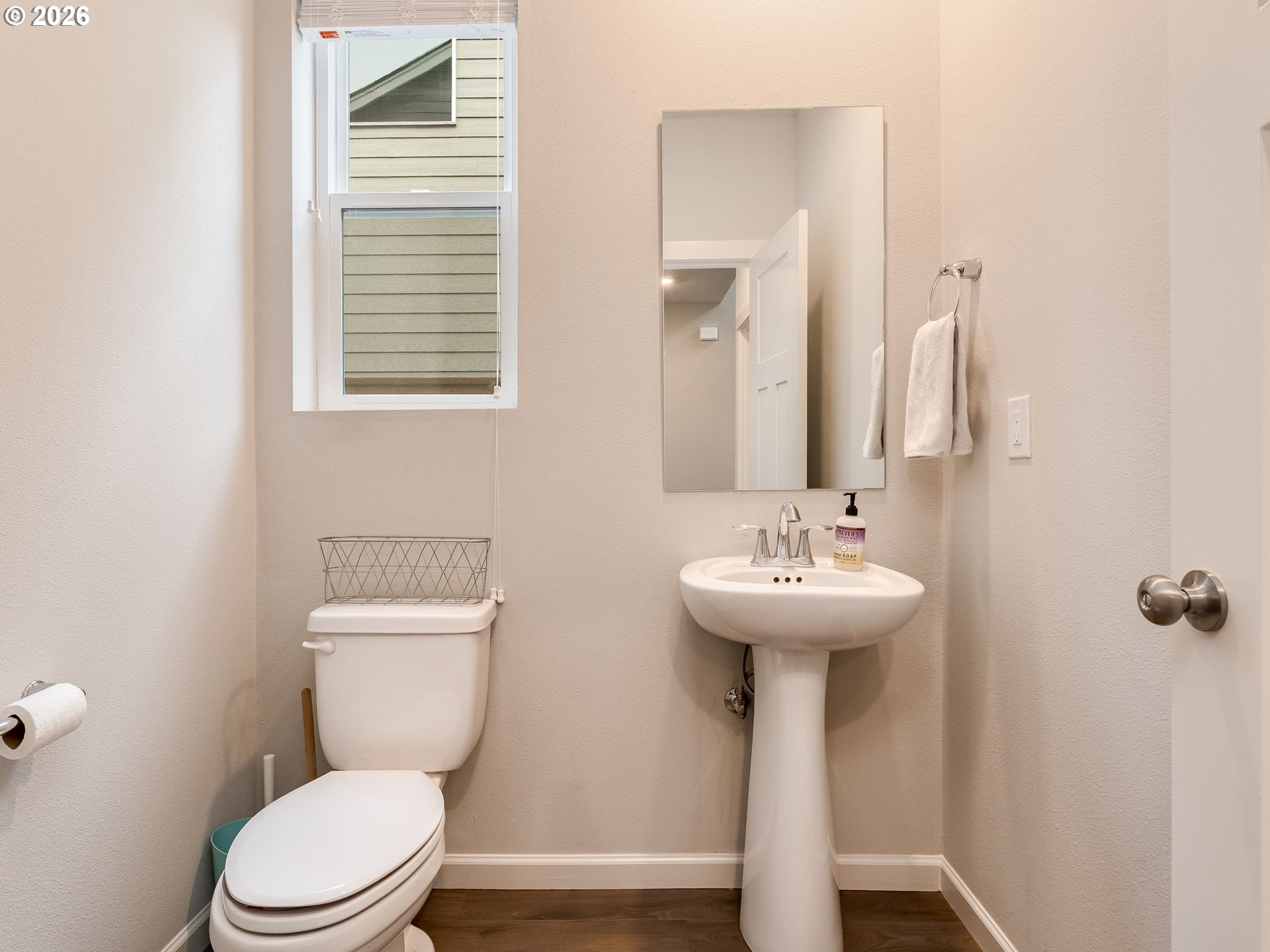 1663 Northwest Edgar Street McMinnville, OR 97128 - Photo 7 of 44 a bathroom with a sink a toilet and mirror