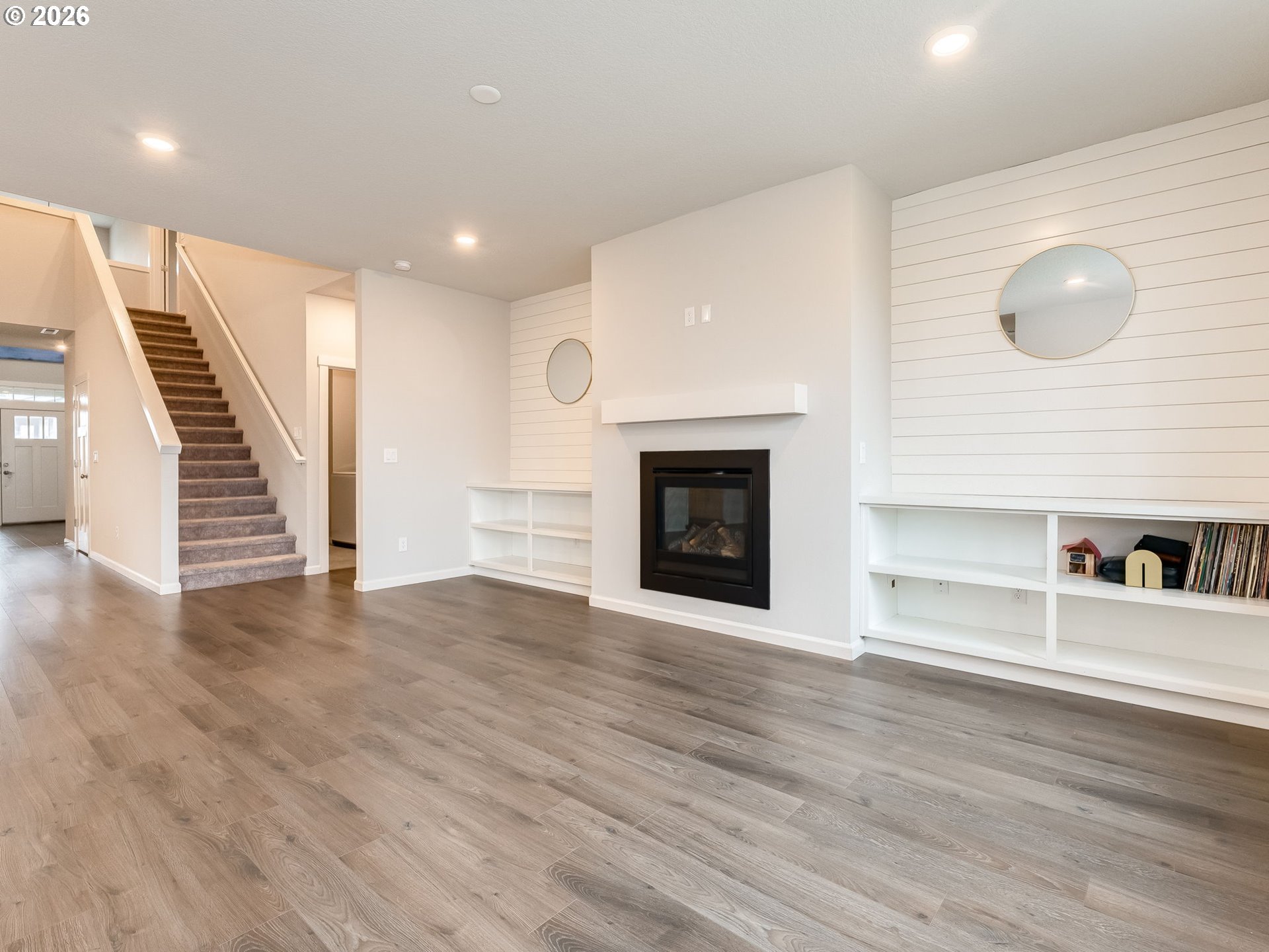 1663 Northwest Edgar Street McMinnville, OR 97128 - Photo 10 of 44 a view of a livingroom with wooden floor and a fireplace