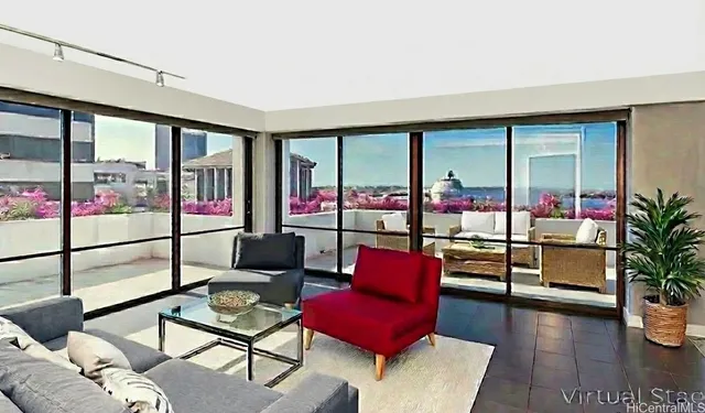 a living room with furniture and a floor to ceiling window