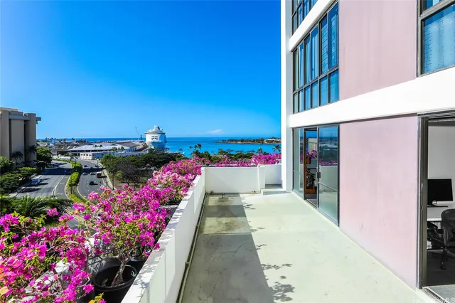 a view of living room kitchen and entryway