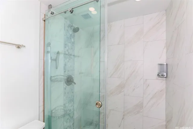 a view of kitchen with stainless steel appliances granite countertop a stove and a wooden cabinets