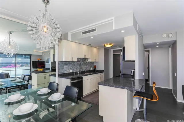 a kitchen with a dining table and chairs