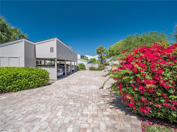 a picture of flowers outside a house