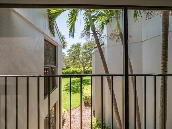 a view of a balcony with door