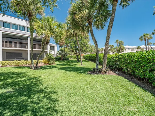 a view of a house with a tree in a yard