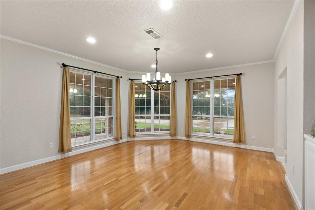 400 Indian Hills Road Gatesville, TX 76528 - Photo 25 of 38 a view of an empty room with wooden floor and a window