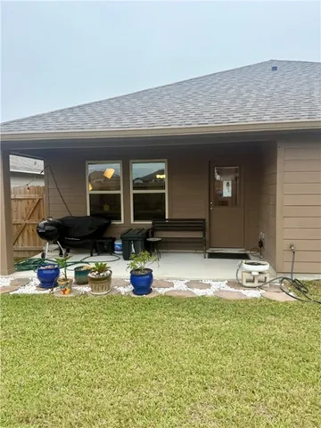 a view of a chairs and table in the patio