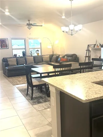 a kitchen with a table and chairs