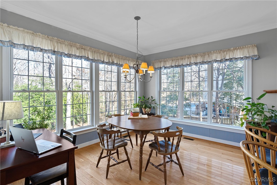 9134 Stephens Manor Drive Mechanicsville, VA 23116 - Photo 15 of 44 Dining area featuring ornamental molding, hardwood