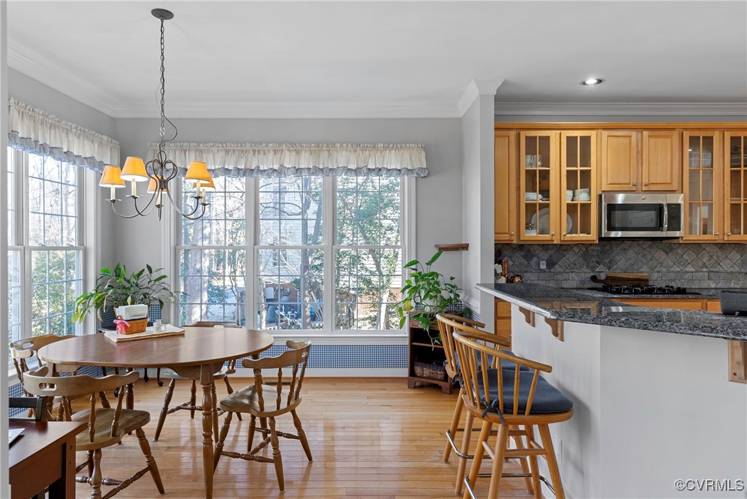 9134 Stephens Manor Drive Mechanicsville, VA 23116 - Photo 16 of 44 Dining area with ornamental molding, windows and