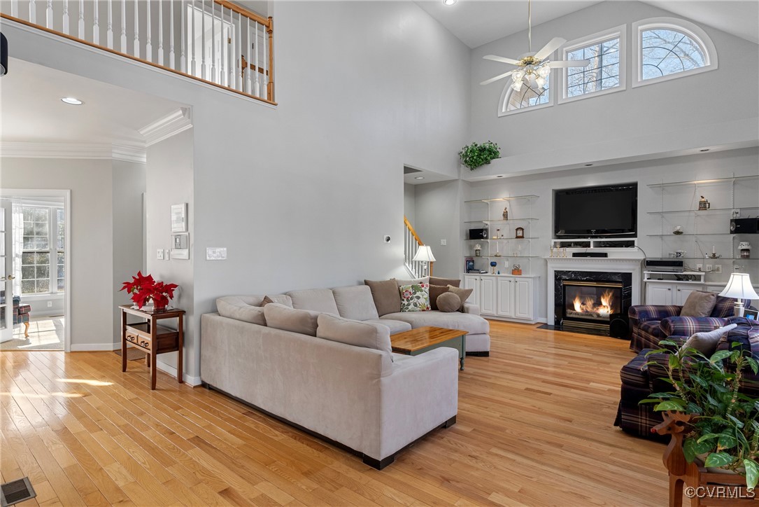 9134 Stephens Manor Drive Mechanicsville, VA 23116 - Photo 17 of 44 Living room featuring a fireplace, crown molding,