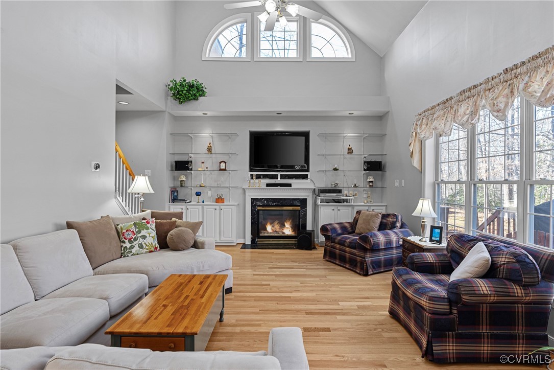 9134 Stephens Manor Drive Mechanicsville, VA 23116 - Photo 18 of 44 Living room featuring a high ceiling, ceiling fan,