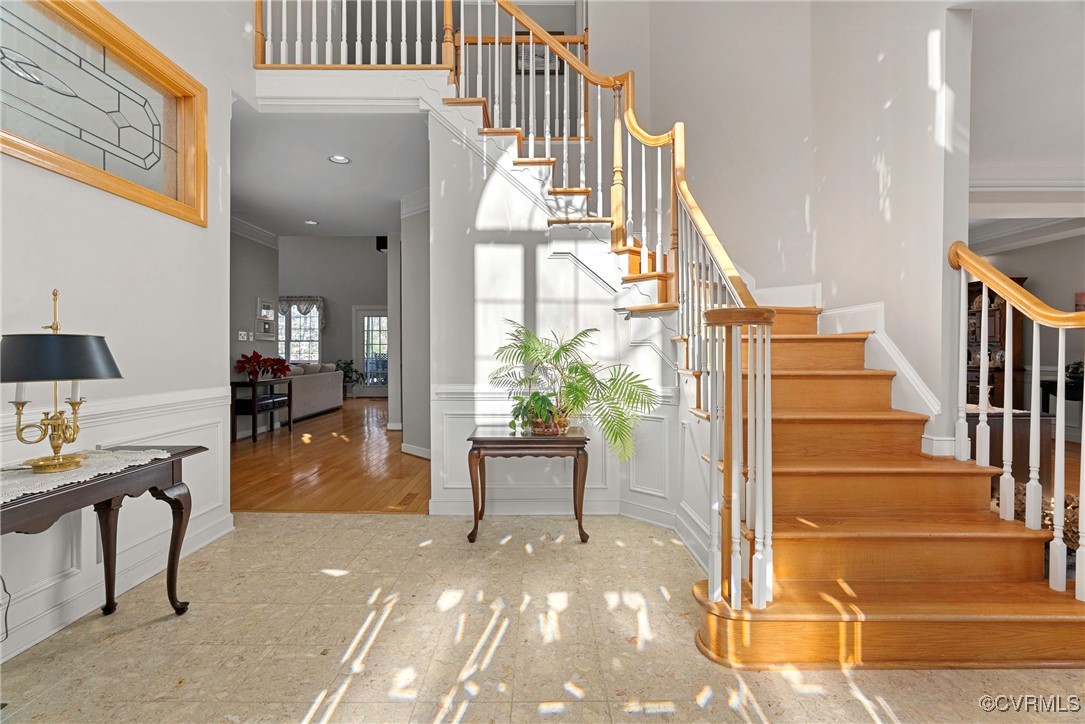 9134 Stephens Manor Drive Mechanicsville, VA 23116 - Photo 2 of 44 Stairway featuring hardwood / wood-style floors an
