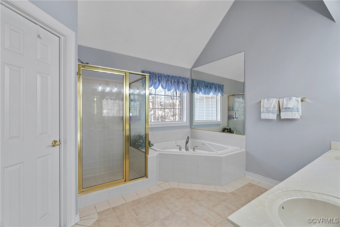 9134 Stephens Manor Drive Mechanicsville, VA 23116 - Photo 27 of 44 Bathroom featuring jetted tub, lofted ceiling, til