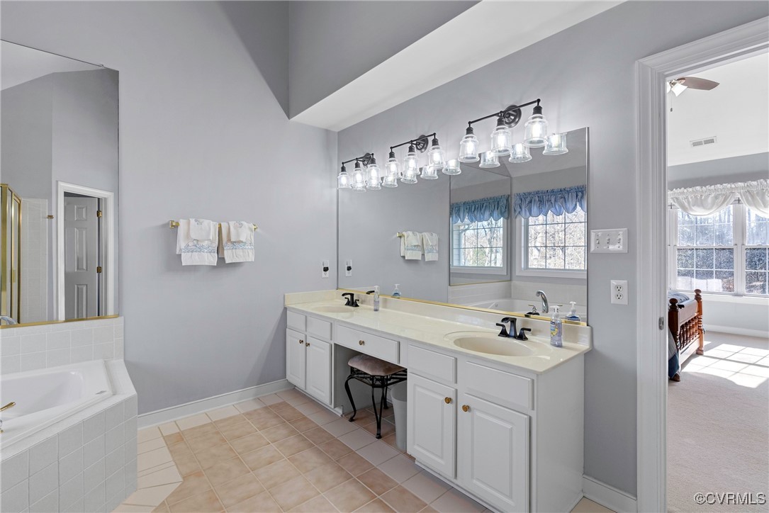 9134 Stephens Manor Drive Mechanicsville, VA 23116 - Photo 28 of 44 Bathroom with vanity, tile patterned flooring, and