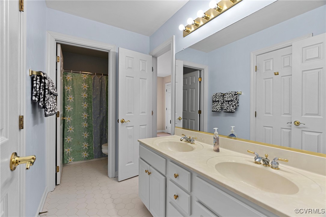 9134 Stephens Manor Drive Mechanicsville, VA 23116 - Photo 33 of 44 Bathroom featuring vanity, toilet, and tile patter