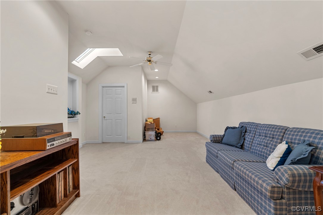 9134 Stephens Manor Drive Mechanicsville, VA 23116 - Photo 36 of 44 light carpet, vaulted ceiling with skylight, and