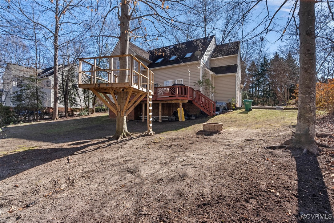 9134 Stephens Manor Drive Mechanicsville, VA 23116 - Photo 39 of 44 Back of house featuring a deck and an outdoor fire