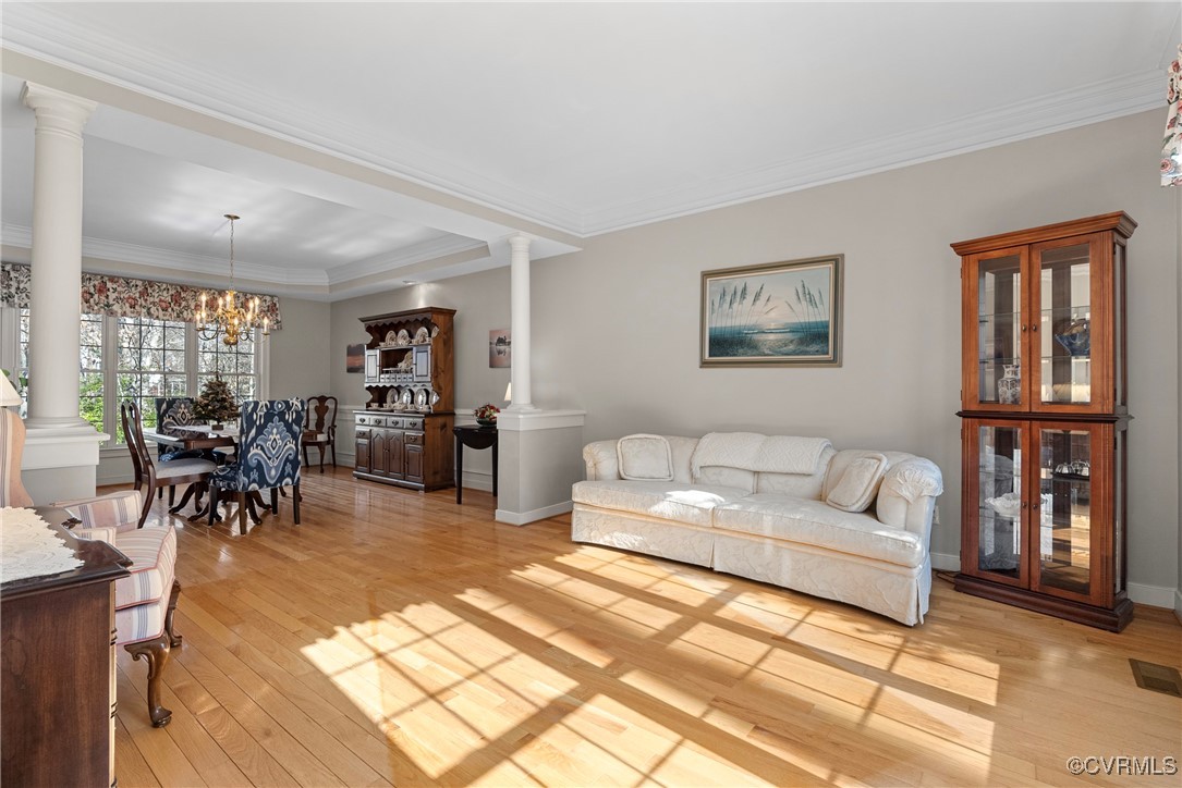 9134 Stephens Manor Drive Mechanicsville, VA 23116 - Photo 4 of 44 Living room featuring ornamental molding, light wo