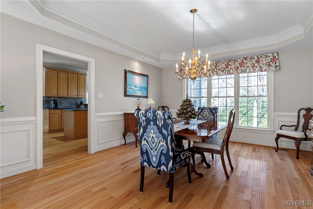 9134 Stephens Manor Drive Mechanicsville, VA 23116 - Photo 7 of 44 Dining space featuring crown molding, a tray ceili