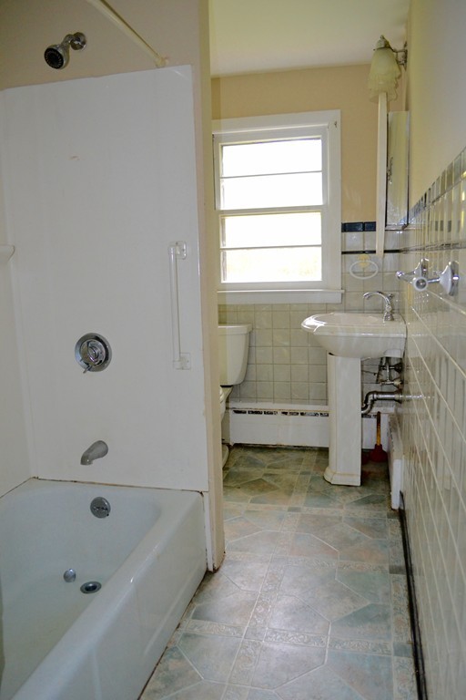77 North Street Three Rivers, MA 01080 - Photo 14 of 20 a bathroom with a tub sink and a window