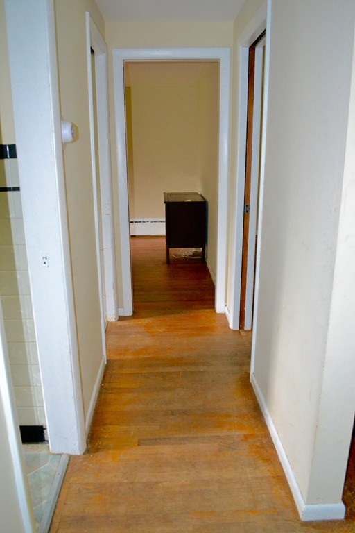 77 North Street Three Rivers, MA 01080 - Photo 15 of 20 a view of a hallway with wooden floor and a living room