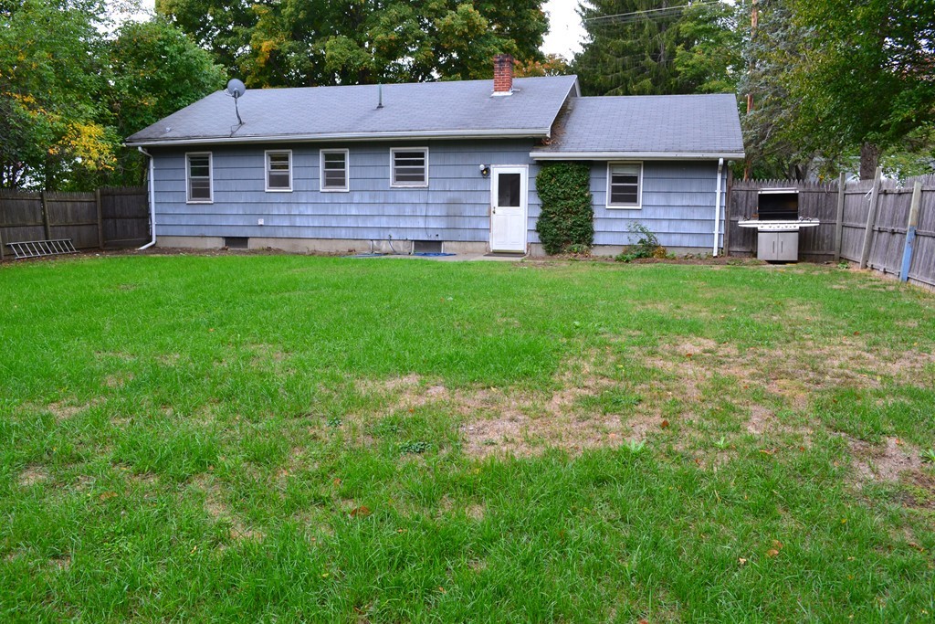 77 North Street Three Rivers, MA 01080 - Photo 17 of 20 a brick house with a big yard