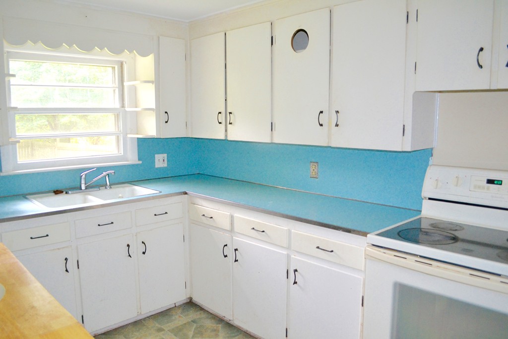77 North Street Three Rivers, MA 01080 - Photo 4 of 20 a kitchen with cabinets appliances and a window
