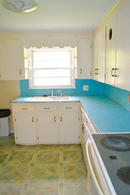 77 North Street Three Rivers, MA 01080 - Photo 5 of 20 a kitchen with a sink a stove and a window
