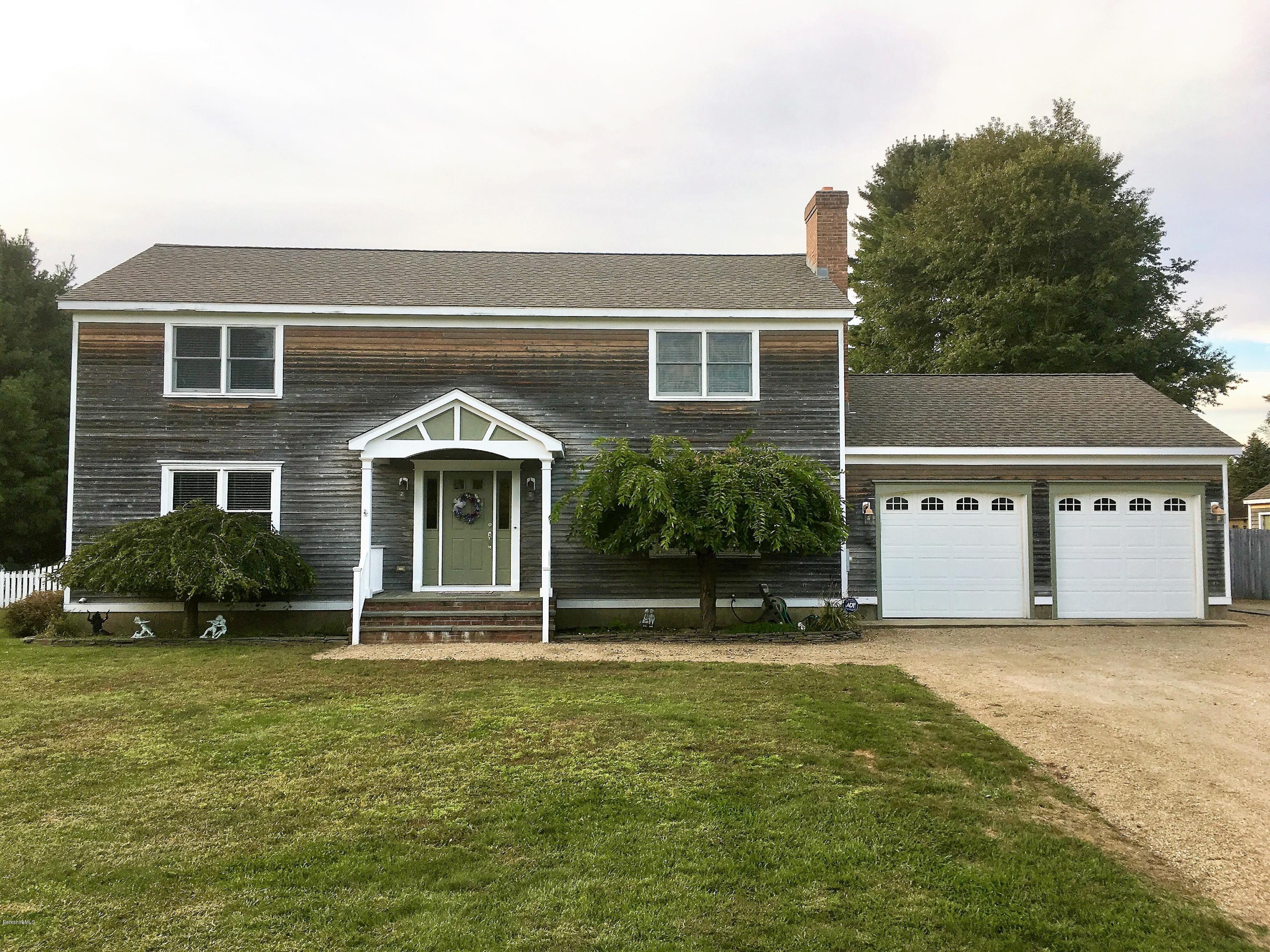 232 Salisbury Road Sheffield, MA 01257 - Photo 1 of 18 a front view of a house with a yard
