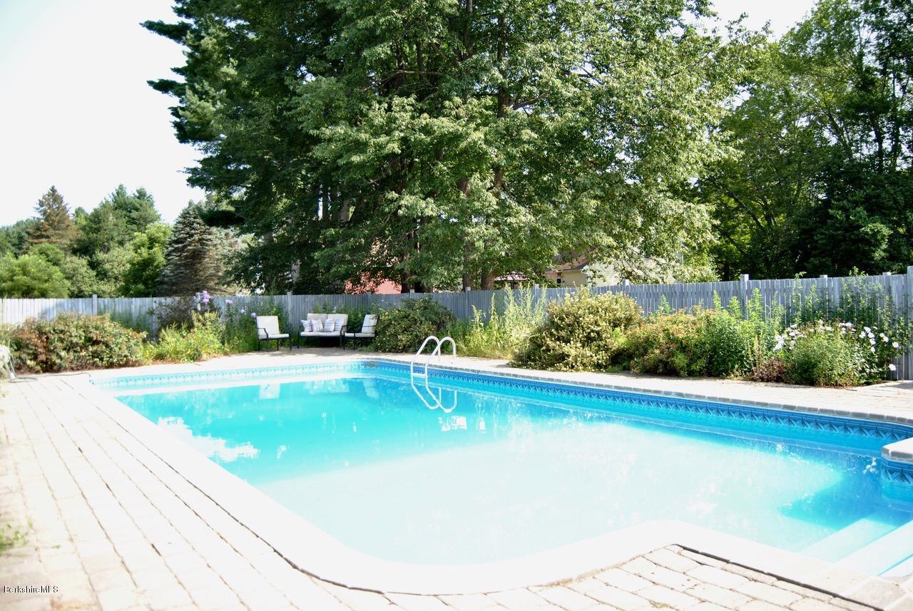 232 Salisbury Road Sheffield, MA 01257 - Photo 2 of 18 a view of a swimming pool with a yard