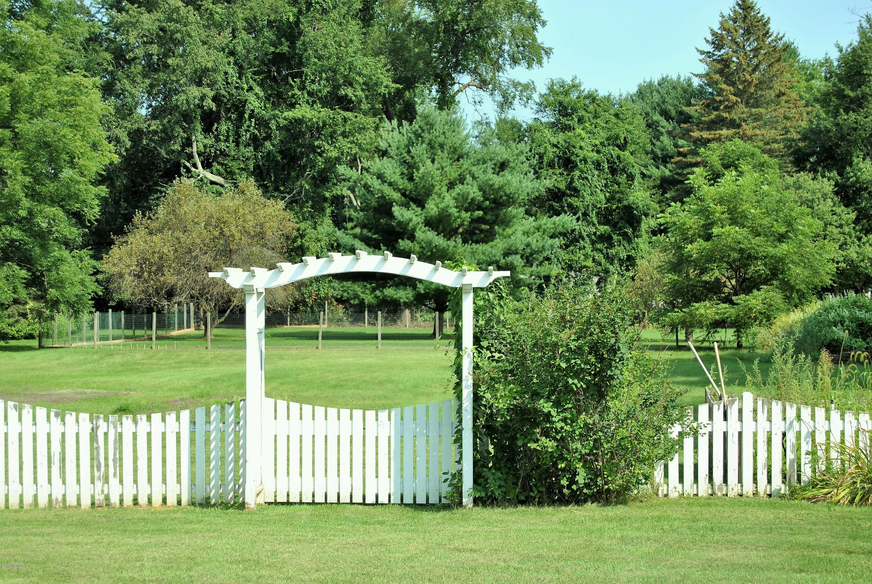 232 Salisbury Road Sheffield, MA 01257 - Photo 16 of 18 a view of a garden with a lake