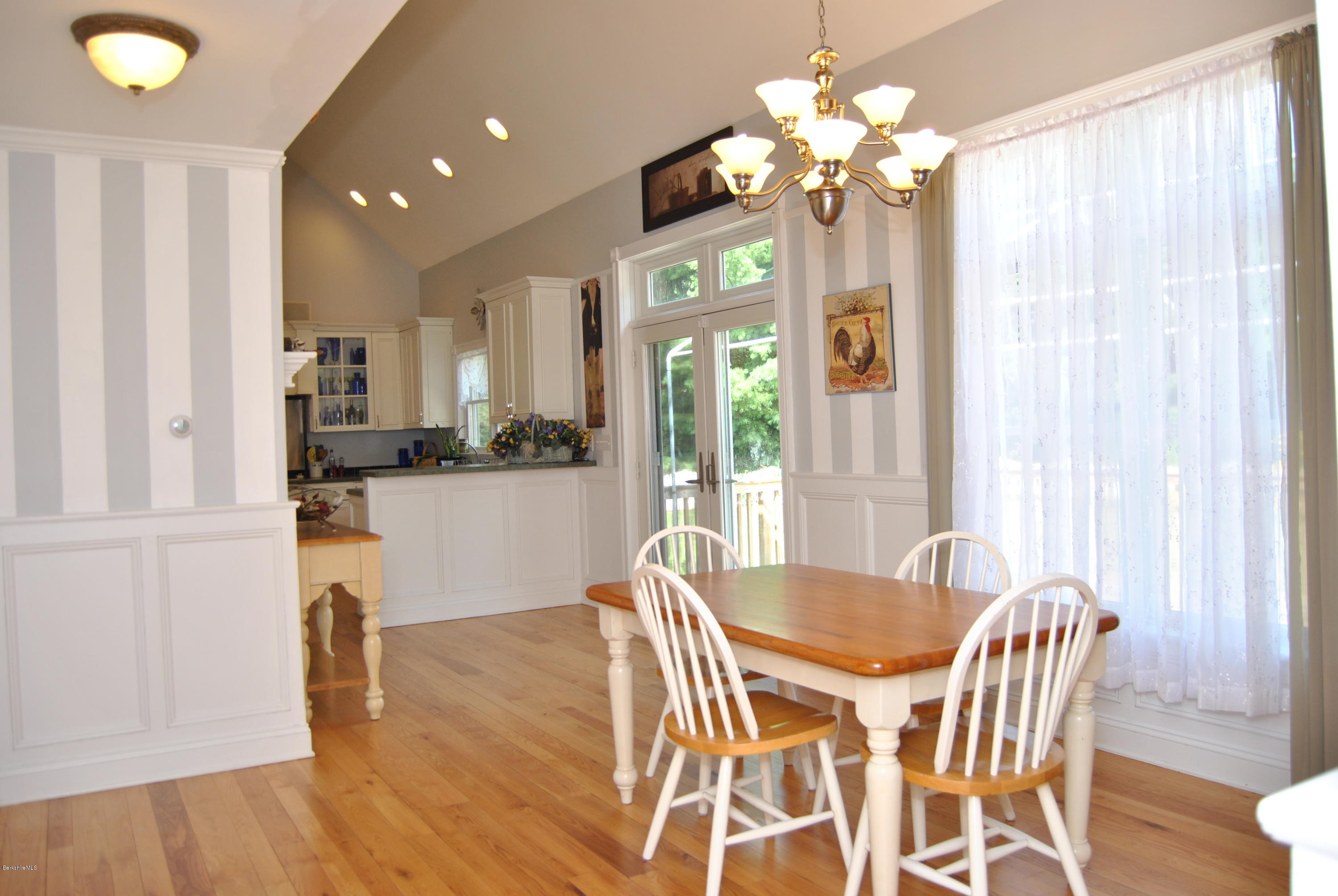 232 Salisbury Road Sheffield, MA 01257 - Photo 4 of 18 a view of a dining room with furniture and chandelier