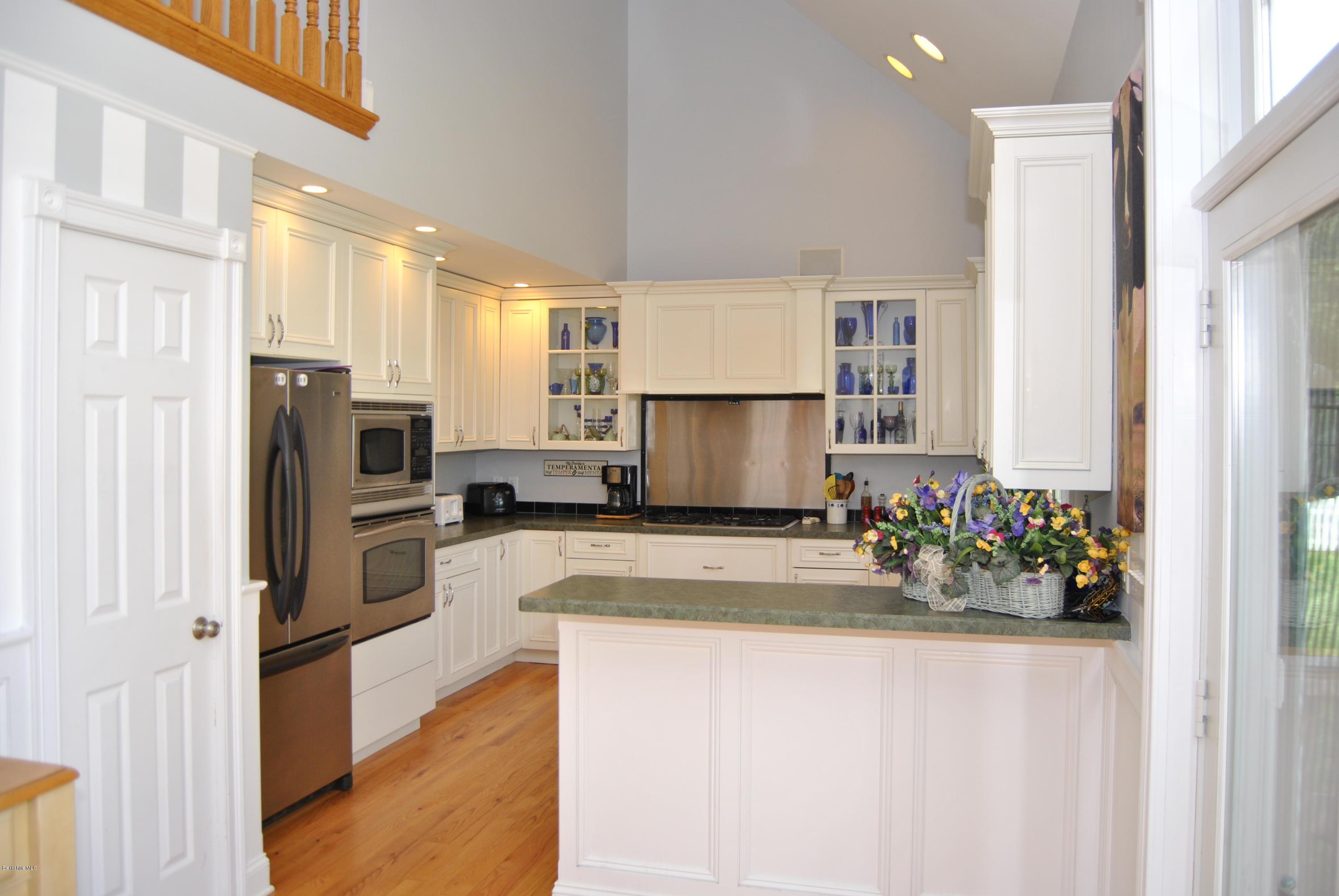 232 Salisbury Road Sheffield, MA 01257 - Photo 5 of 18 a kitchen with stainless steel appliances a refrigerator sink and stove