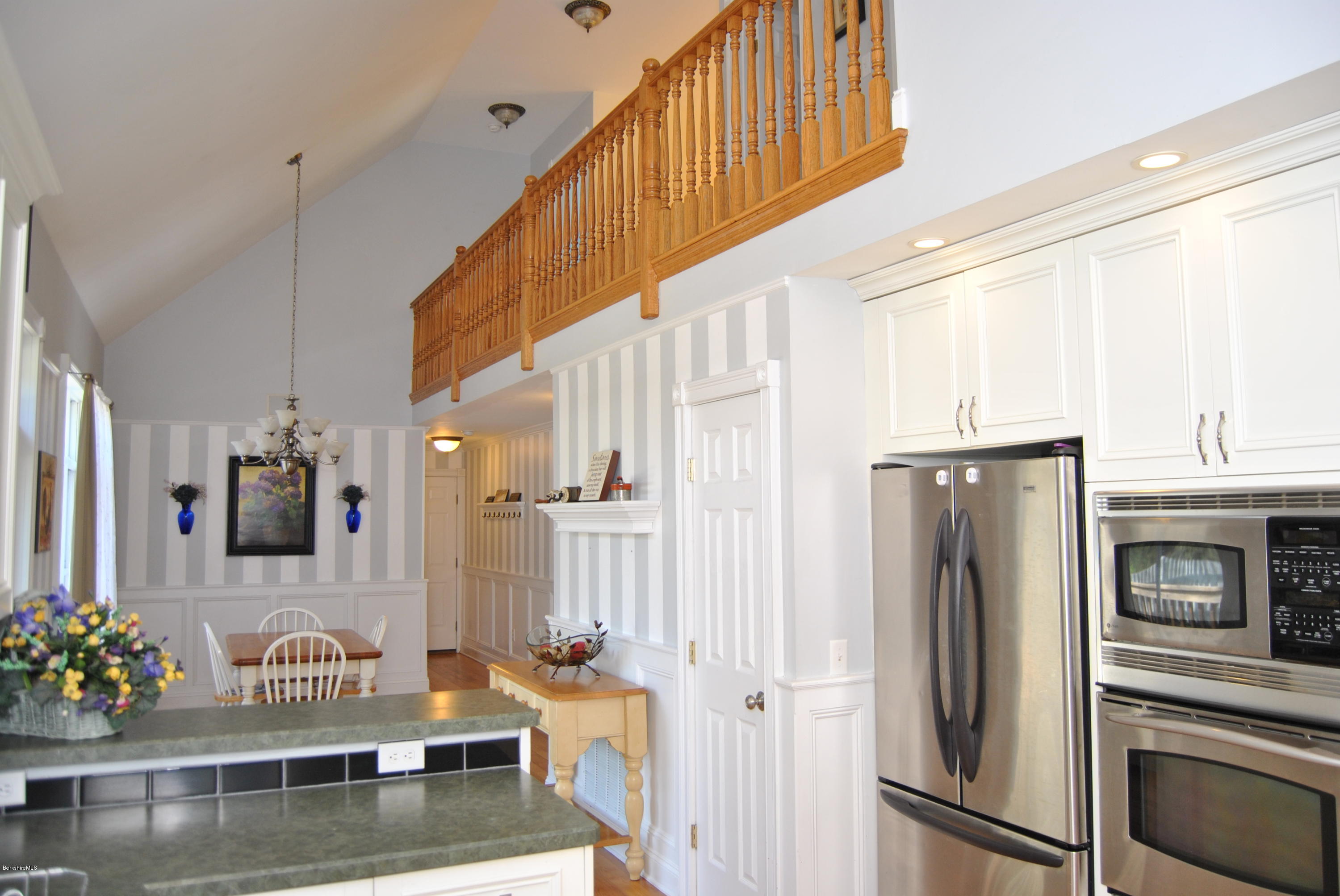 232 Salisbury Road Sheffield, MA 01257 - Photo 6 of 18 a kitchen with stainless steel appliances kitchen island granite countertop a refrigerator and a stove