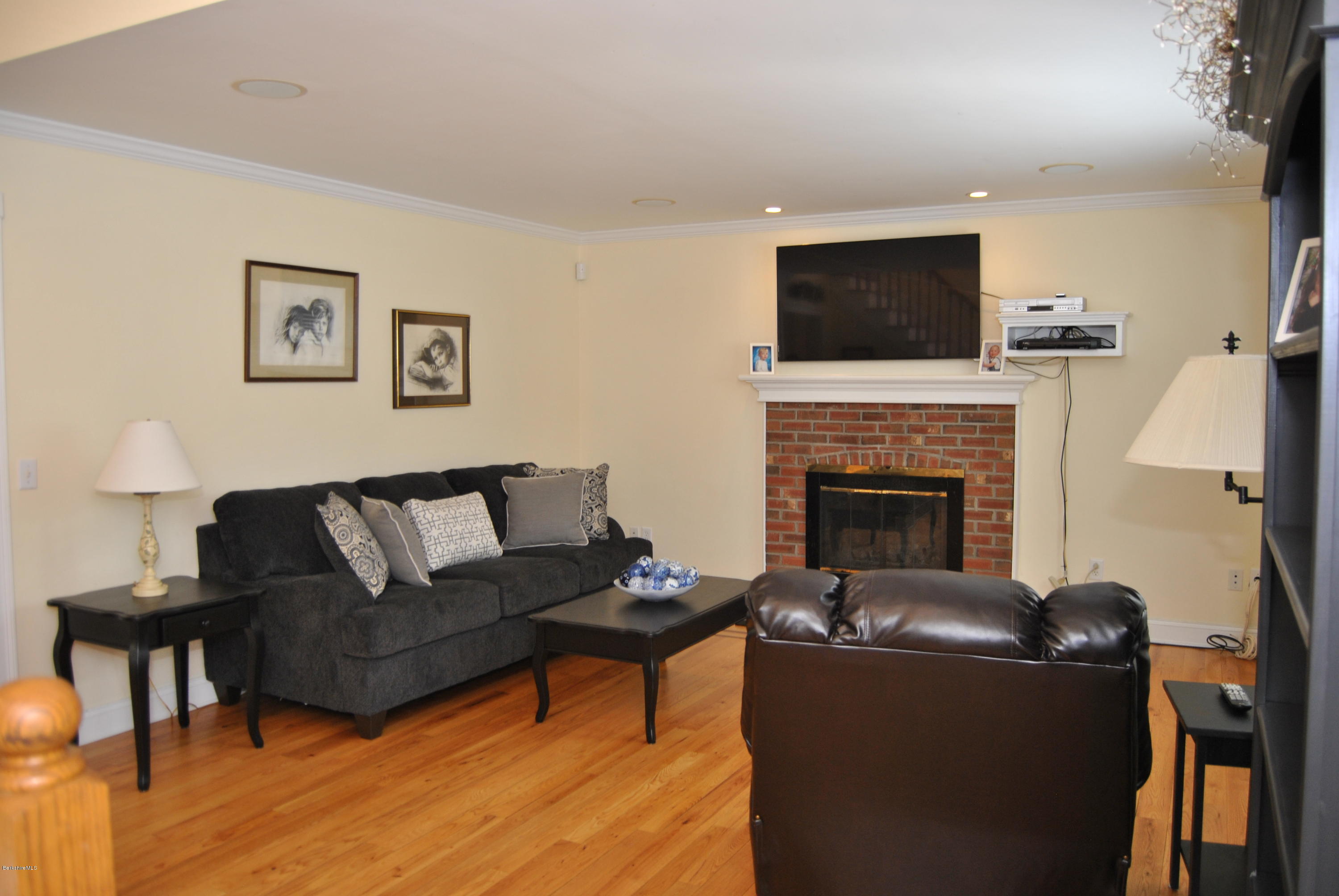 232 Salisbury Road Sheffield, MA 01257 - Photo 8 of 18 a living room with furniture a flat screen tv and a fireplace
