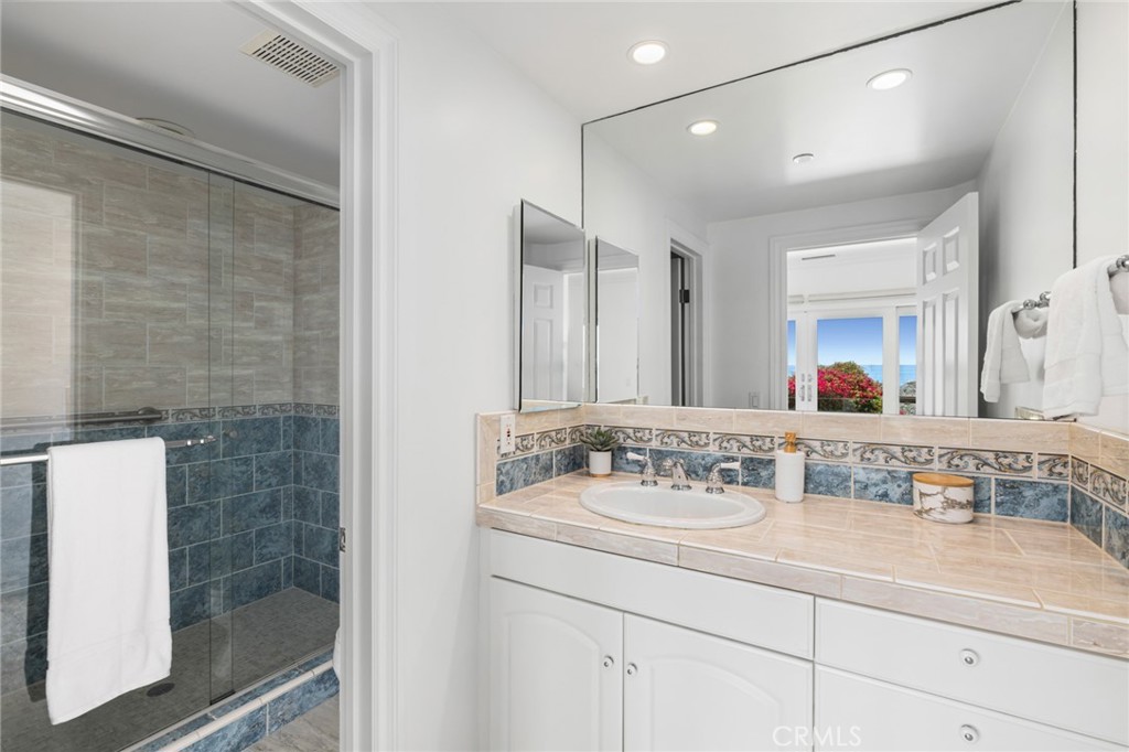 326 Boca Del Canon San Clemente, CA 92672 - Photo 45 of 69 a bathroom with a sink and a mirror
