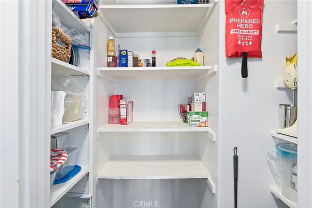 a view of a chair and table in the balcony