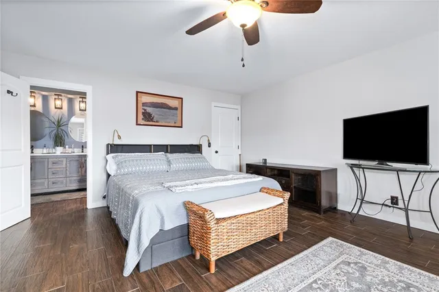 a bedroom with a bed and windows