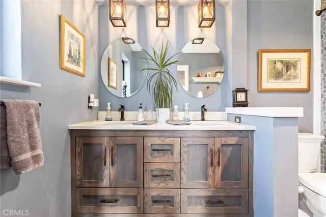 a view of a chair and tables in the balcony