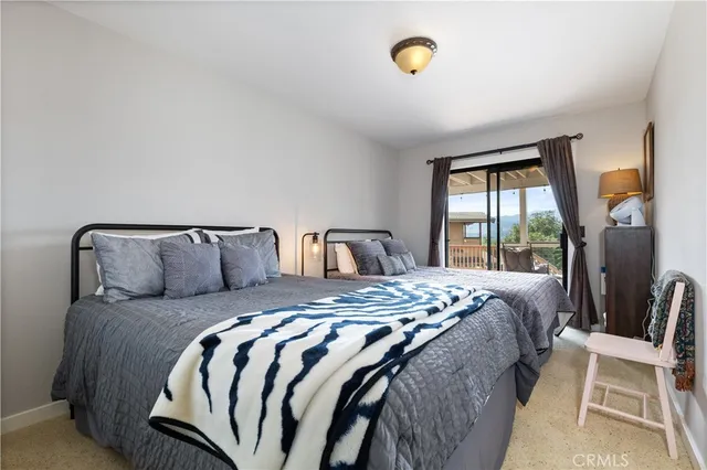 a swimming pool with outdoor seating and yard