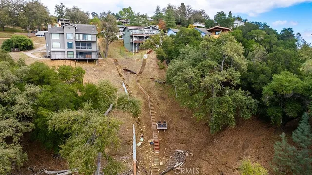 a view of a terrace with a bench and trees