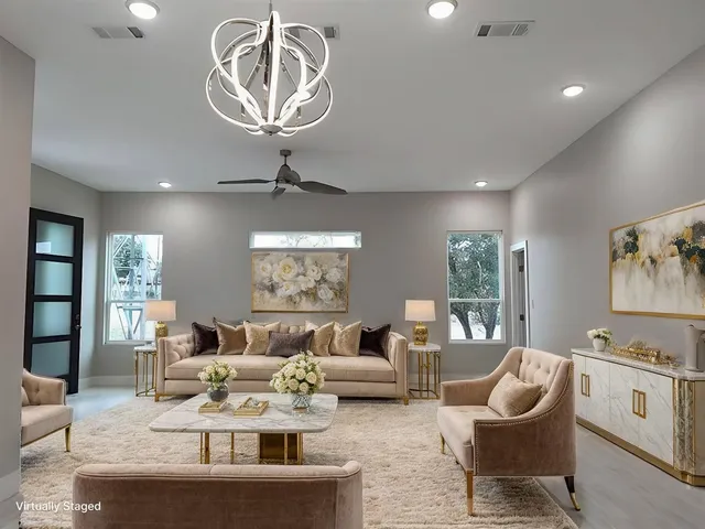 a living room with furniture and kitchen view