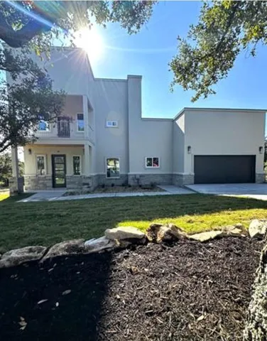 a house with swimming pool in front of it