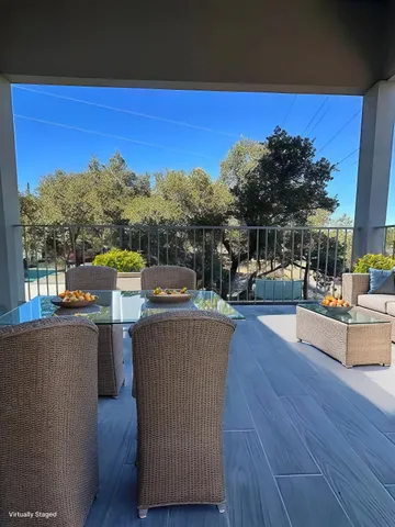 a view of a terrace with sitting area