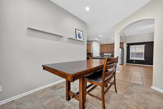 a kitchen with a table and chairs in it
