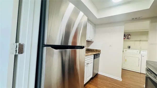 a view of hallway with wooden floor