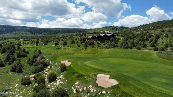 a view of a golf course with a garden