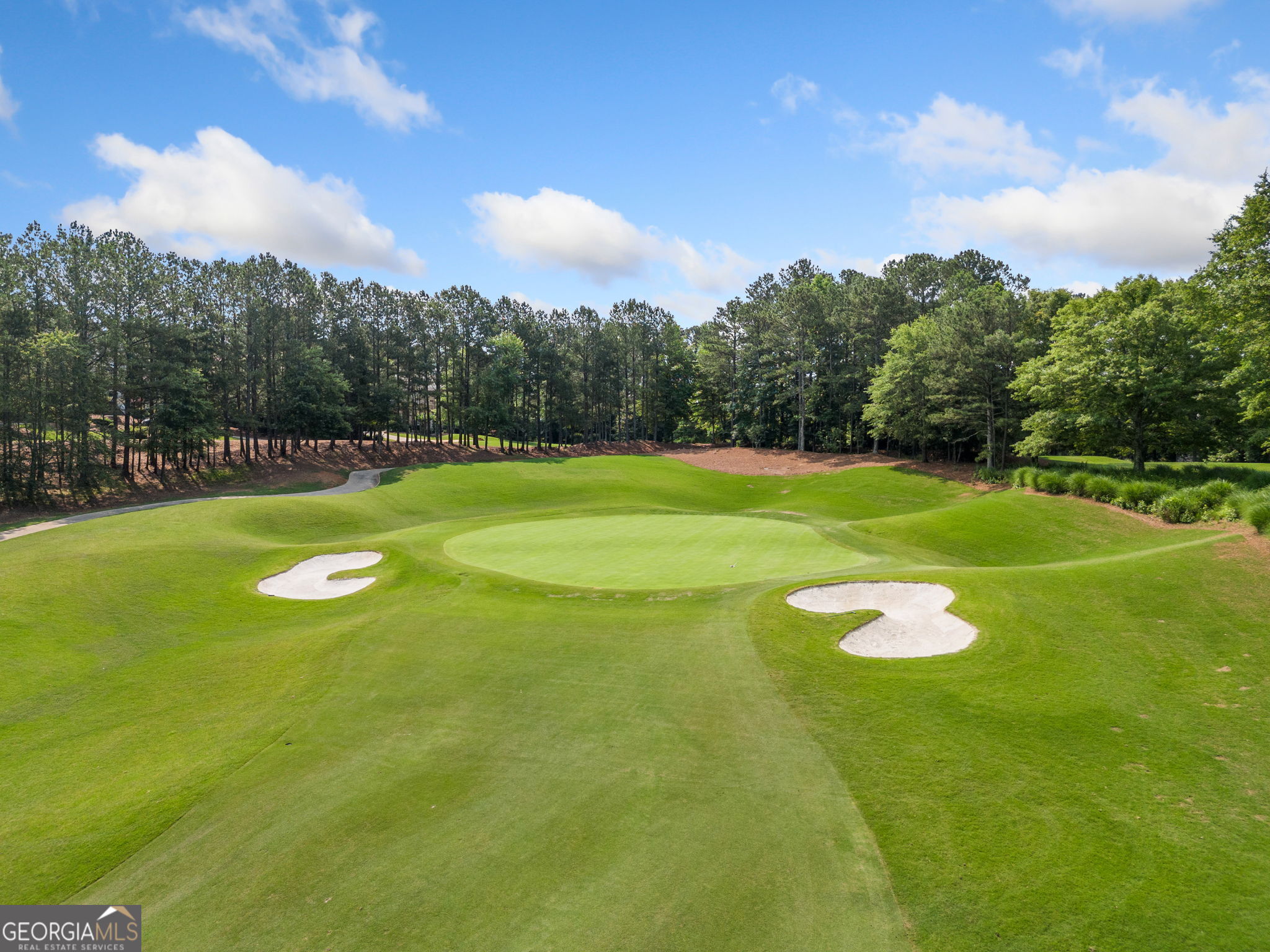 240 Brock Trail, Unit 4 Milton, GA 30004 - Photo 5 of 31 a view of a golf course with a lake