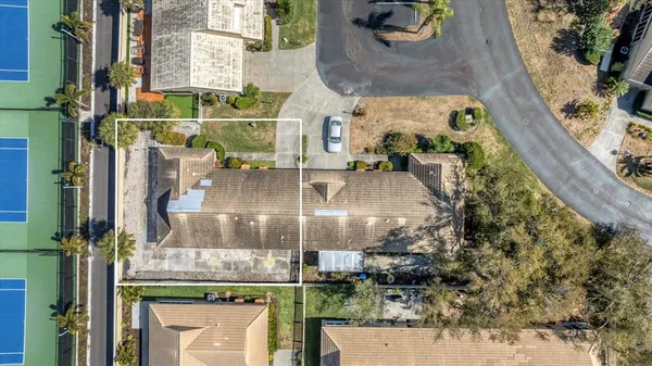 an aerial view of houses with outdoor space
